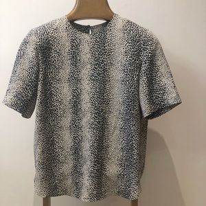 Short sleeve animal print w/ button closure on back size xs